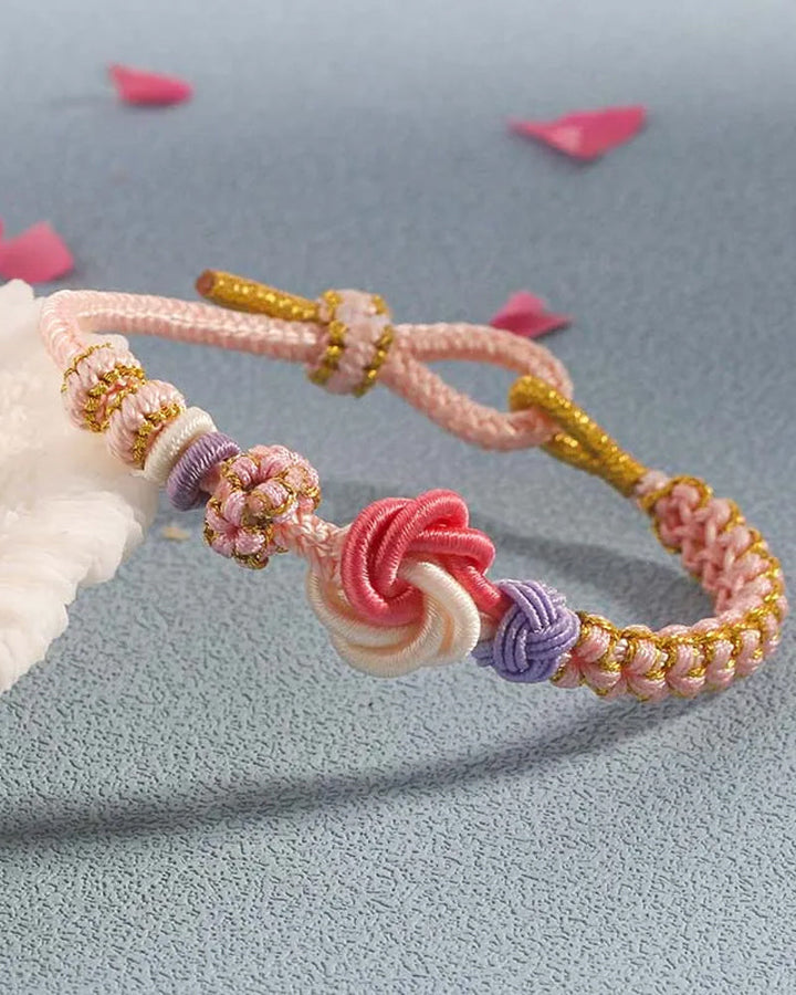 Bracelet avec noeud de fleurs de pêcher