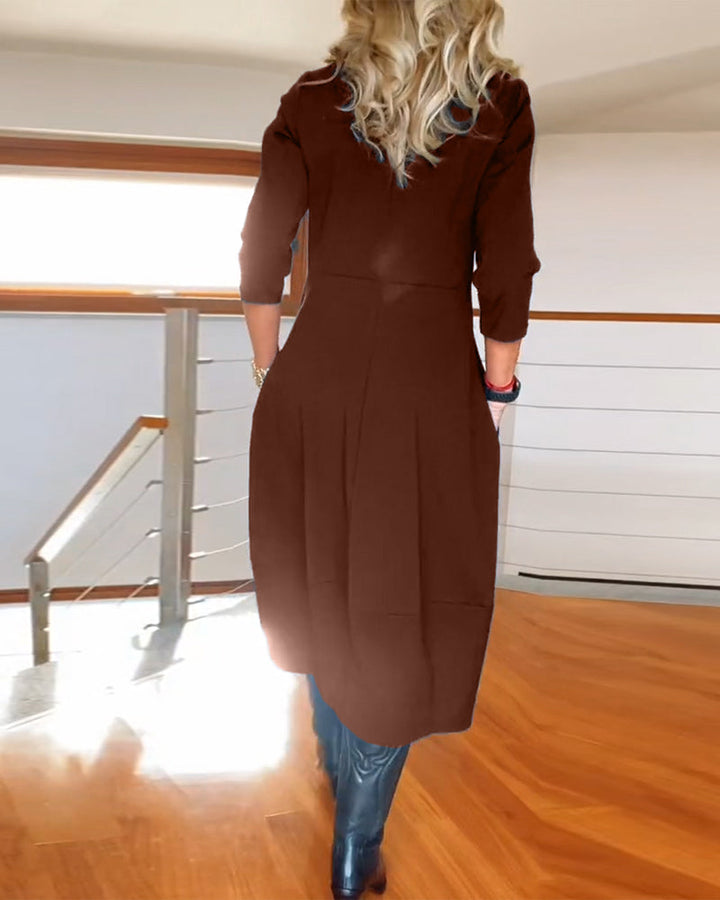 Robe élégante de couleur unie avec poche et col rond